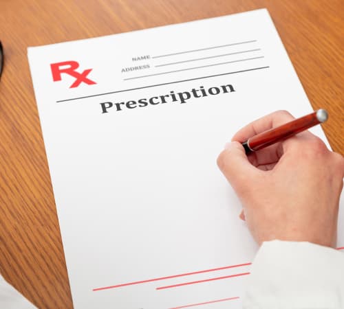 A picture of a doctor written on the Prescription paper.